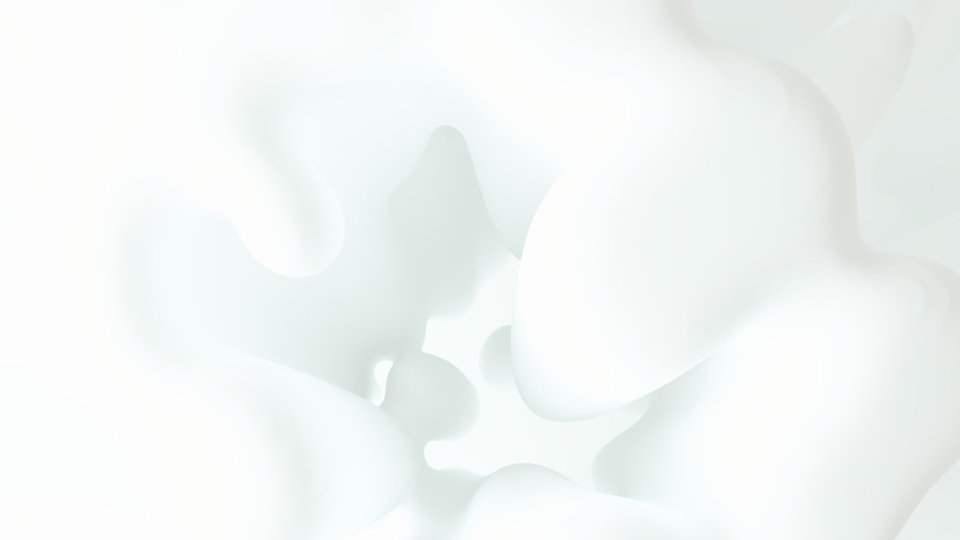 A blurry photo of white flowers on a white background