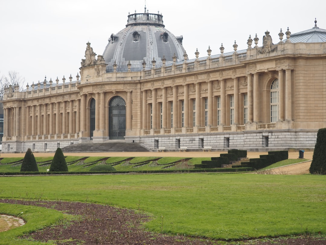 a large building with a large lawn in front of it