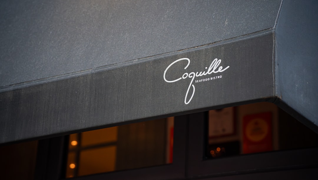 a close up of a sign on the side of a building