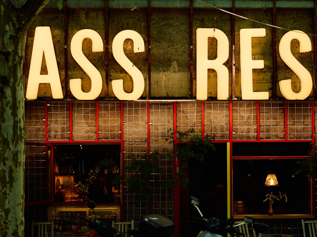 a motorcycle is parked outside of a restaurant